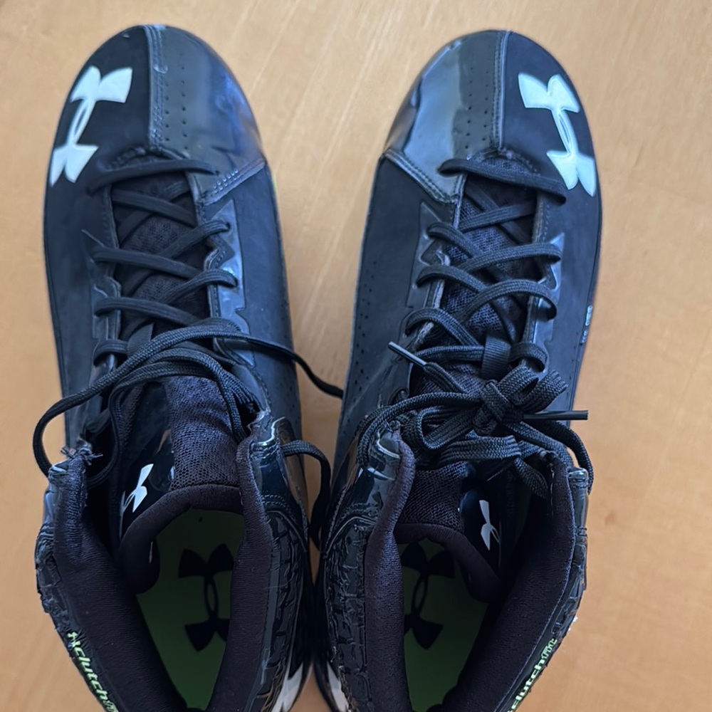 Men’s size 13 Under Armour Black High-Top Football Cleats